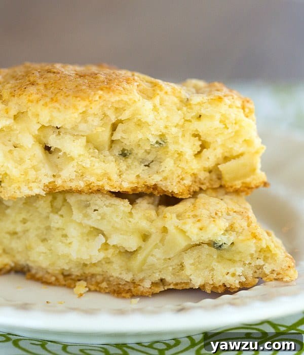 A basket of freshly baked Apple Gruyere and Sage Scones, warm and inviting