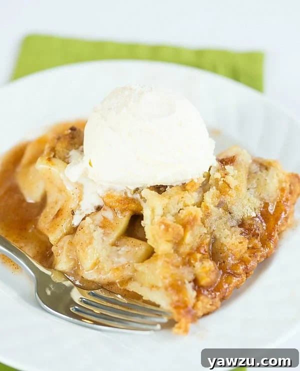 Slice of Maple-Apple Pie with Walnut Crumb Topping, ready to be served.