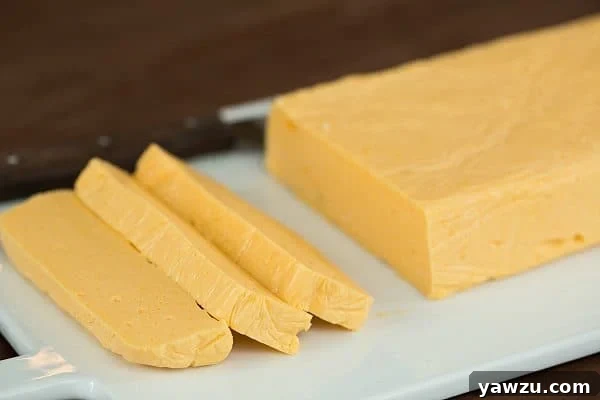 Close-up of freshly made homemade Velveeta cheese, showcasing its smooth, creamy texture.