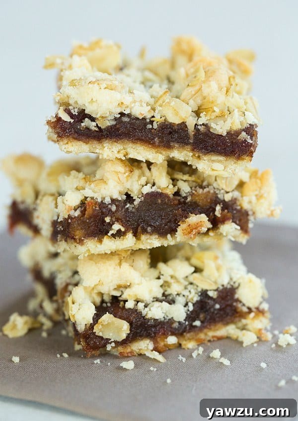 Delicious Maple-Date Bars with a golden oat crumble topping on a cooling rack.