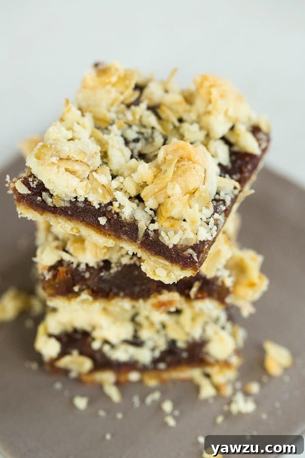 Maple-Date Bars neatly sliced and arranged, showcasing the layers of crust and filling.