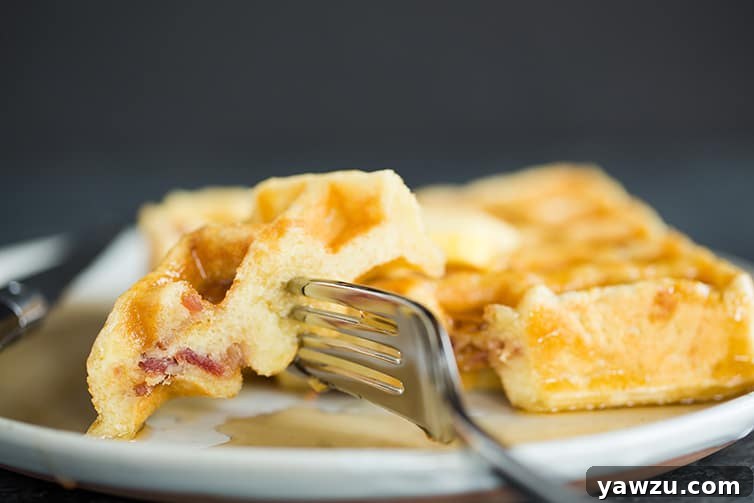 Taking a big bite of Brown Sugar-Bacon Buttermilk Waffles