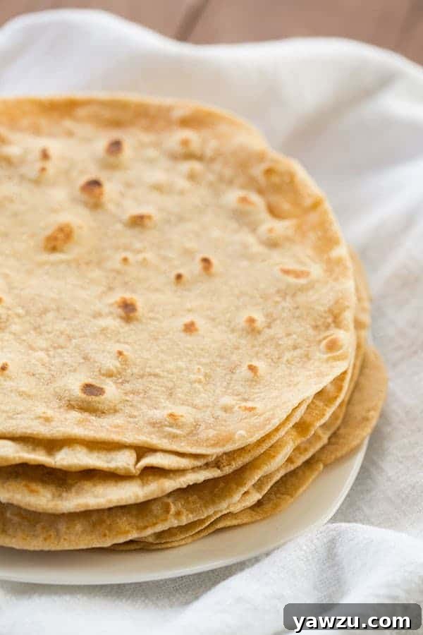 Homemade Flour Tortillas: Freshly made, soft, and delicious tortillas stacked, ready for use.