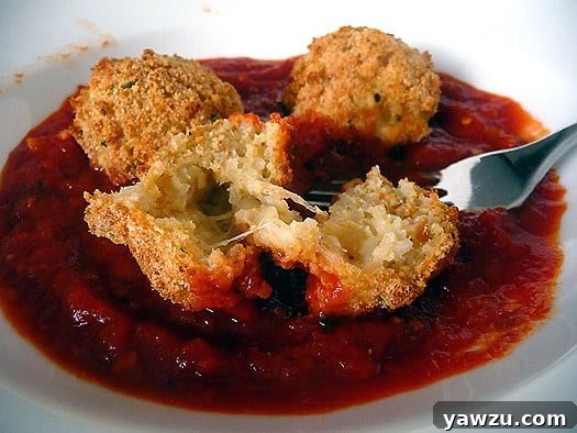 Mozzarella-filled-Arancini-Italian-rice-balls-inside