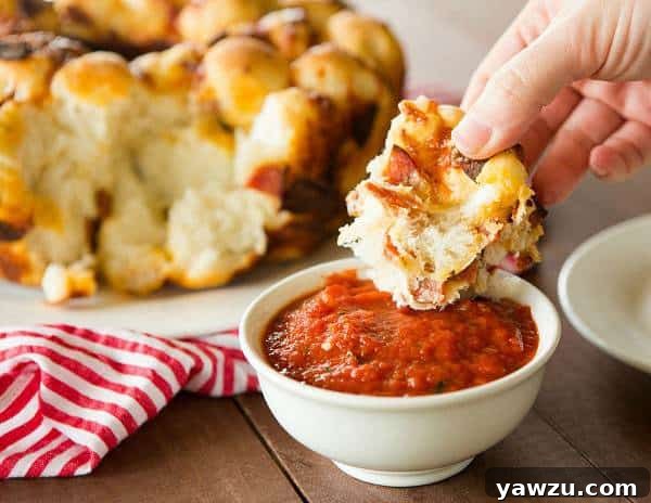 A perfectly baked Pepperoni Pizza Monkey Bread, inverted onto a serving plate, ready to be pulled apart and shared.