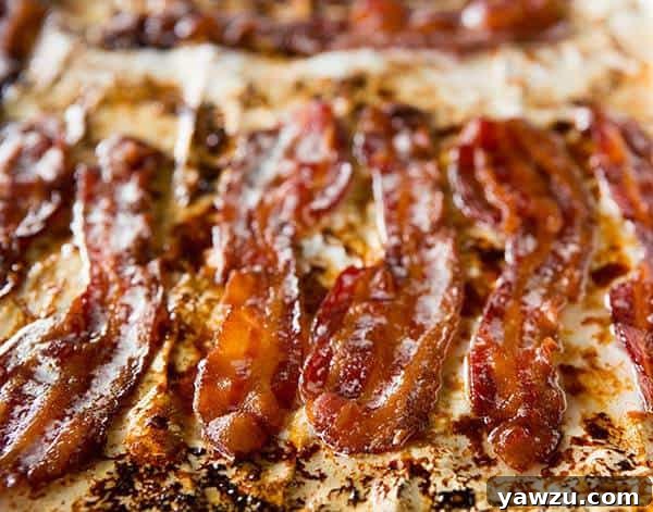 Close-up of golden, caramelized Bourbon-Brown Sugar Bacon slices.