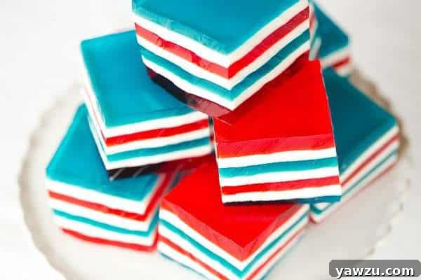 Assortment of Red, White & Blue Layered Finger Jello squares on a serving platter