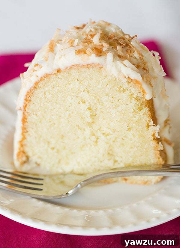 Decadent Coconut Bundt Cake with White Chocolate-Coconut Glaze, perfect for gatherings and special occasions