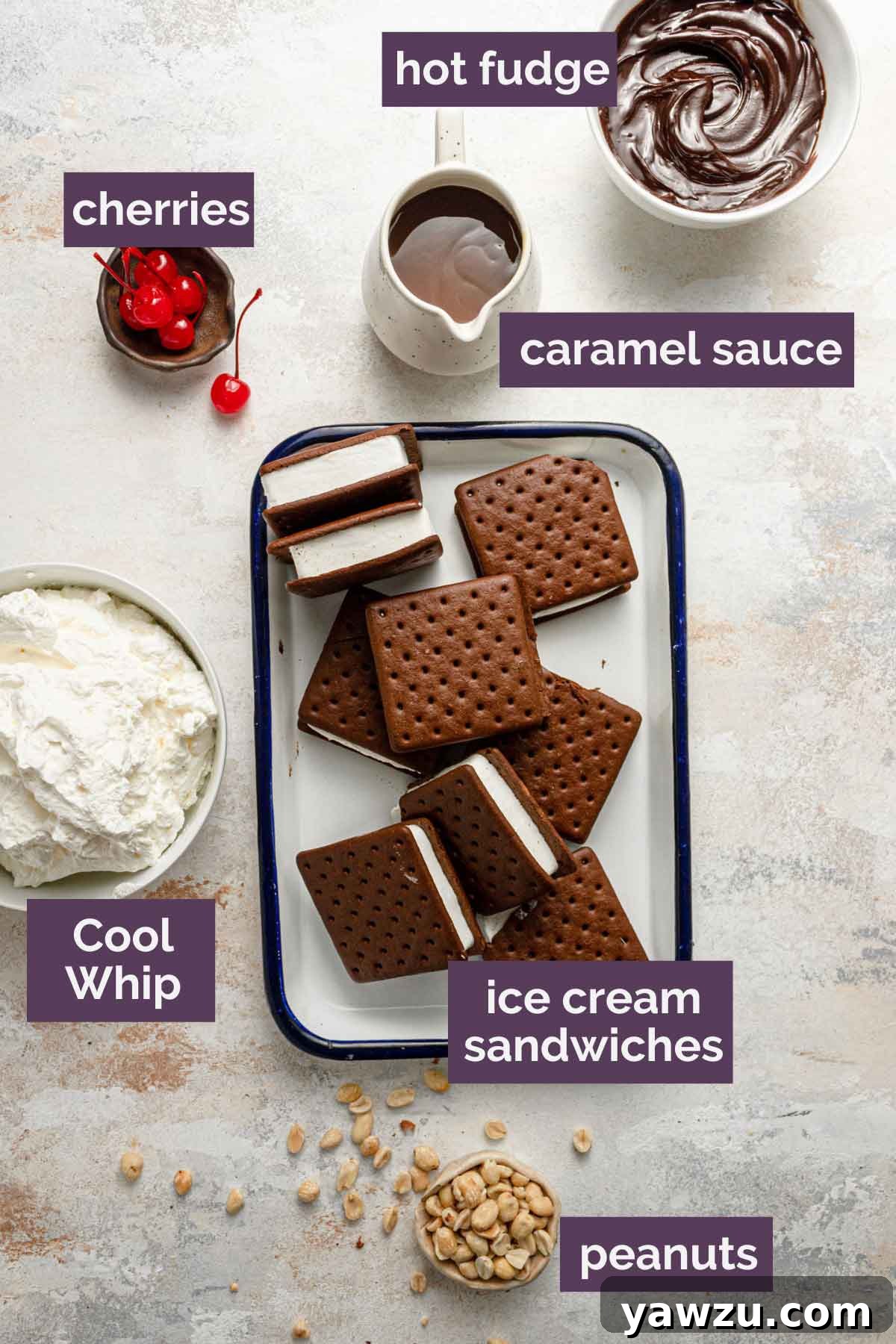 All the essential ingredients for an ice cream sandwich cake laid out neatly: a box of ice cream sandwiches, a jar of caramel sauce, a jar of hot fudge, and a tub of whipped topping.