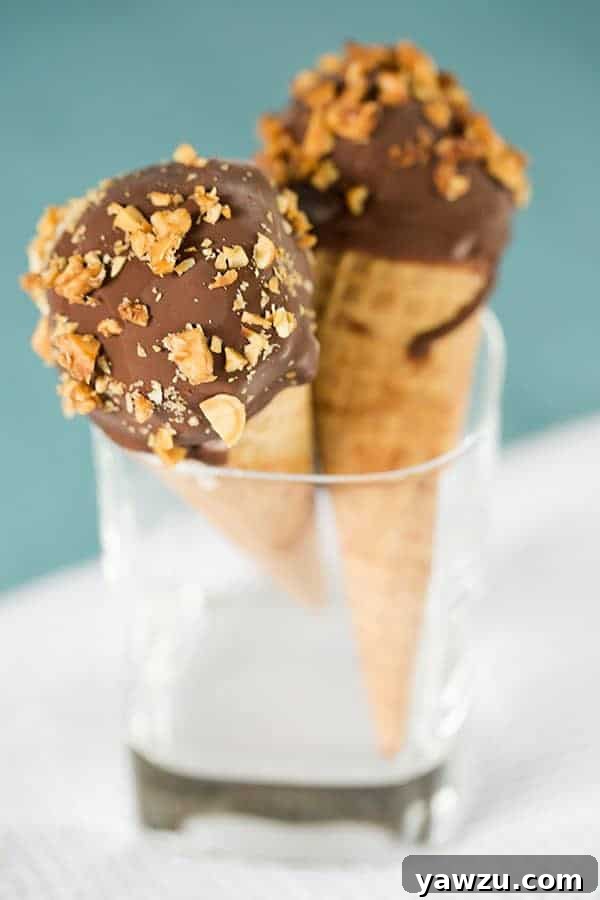 Homemade Drumsticks: A delicious, chocolate-coated sugar cone filled with creamy vanilla ice cream, dipped in chocolate, and rolled in crunchy peanuts. Perfect for DIY frozen treats!