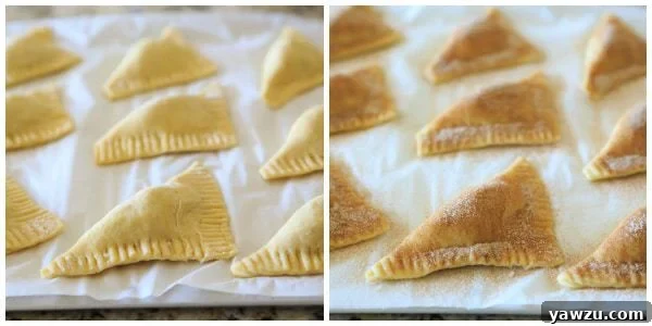 Close-up of apple turnovers cooling, highlighting their flaky crust and golden exterior.