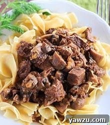 A bowl of Slow Cooker Beef Stroganoff with egg noodles, ready to be served.