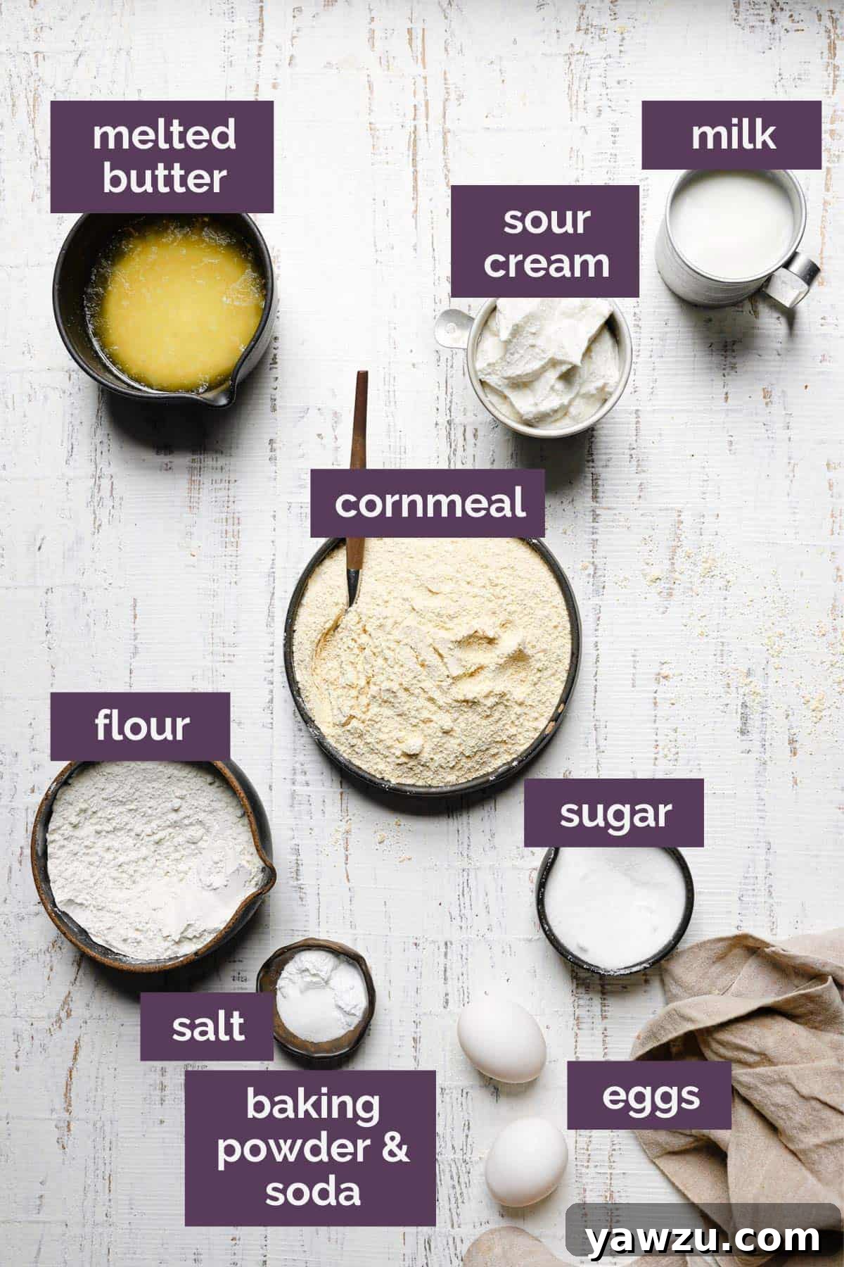 A top down photo of the ingredients for cornbread muffins labeled with purple tags.