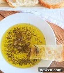 A bowl of rich roasted garlic dipping oil, perfect with bread.