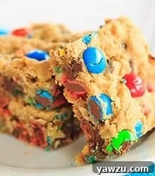 Monster Cookie Bars with peanut butter, oats, chocolate chips, and M&M's.