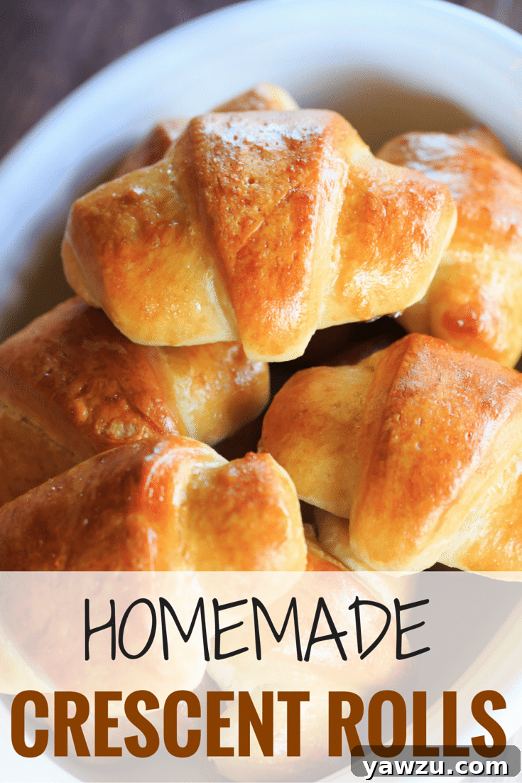 Golden-brown, flaky homemade crescent rolls stacked in a rustic basket, ready to be served at a festive holiday meal.