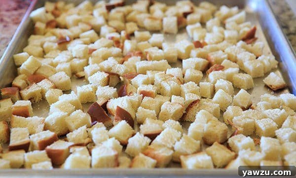 Sausage, Apple & Sage Stuffing in a baking dish, ready to be served. | https://www.browneyedbaker.com/sausage-apple-sage-stuffing/