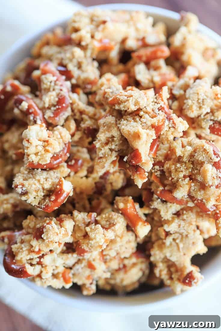 Delicious Malted Pretzel Crunch scattered on a baking sheet, ready to be enjoyed.