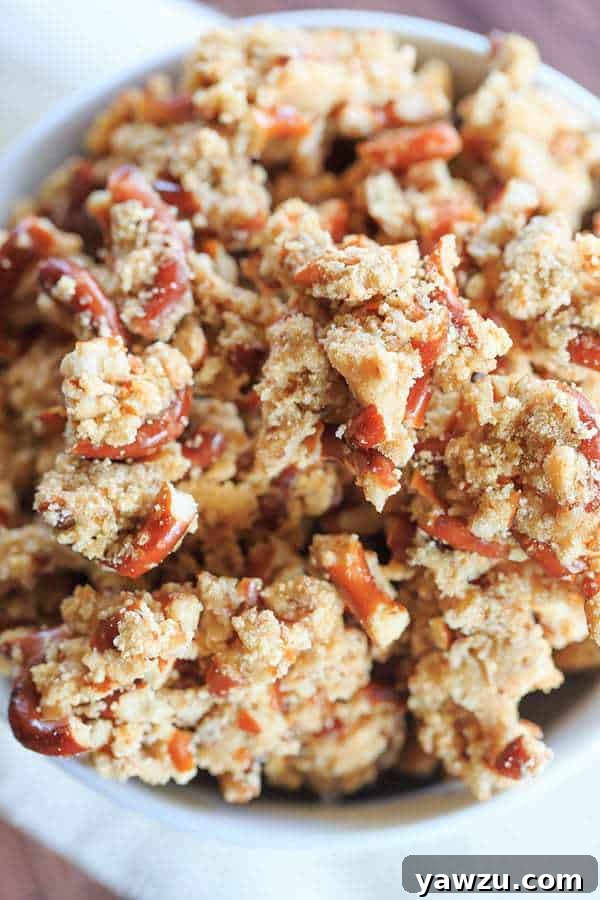Close-up of Malted Pretzel Crunch pieces, highlighting their golden-brown, clustered texture.