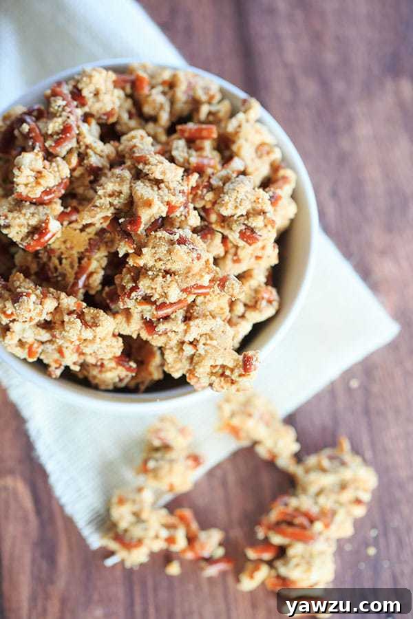 A generous serving of Malted Pretzel Crunch, highlighting its golden hue and delicious texture.