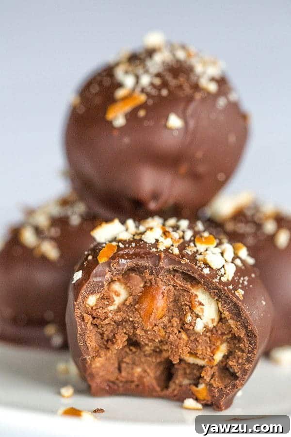 A beautifully arranged plate of homemade Nutella Pretzel Truffles, showcasing their rich chocolate coating and pretzel crunch.