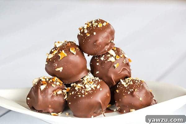 Close-up of a halved Nutella Pretzel Truffle, revealing the crunchy pretzel pieces within the smooth Nutella filling.