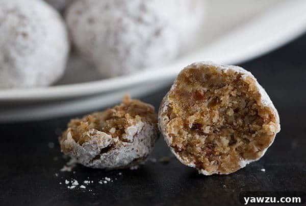 A plate of fluffy, no-bake Paleo snowball cookies ready to be enjoyed.