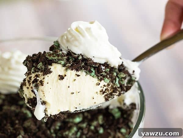 Baileys White Chocolate Mousse - Spiked white chocolate mousse layered into a trifle dish with crushed mint Oreos. An easy dessert for your St. Patrick's Day celebration!