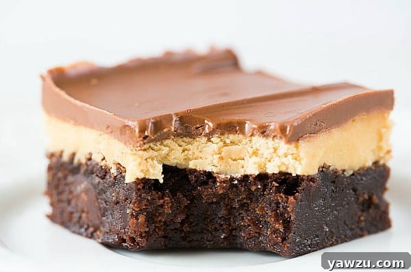 Buckeye Brownies: Fudgy chocolate brownies topped with a creamy peanut butter layer and a luscious chocolate ganache. The ultimate brownie experience.