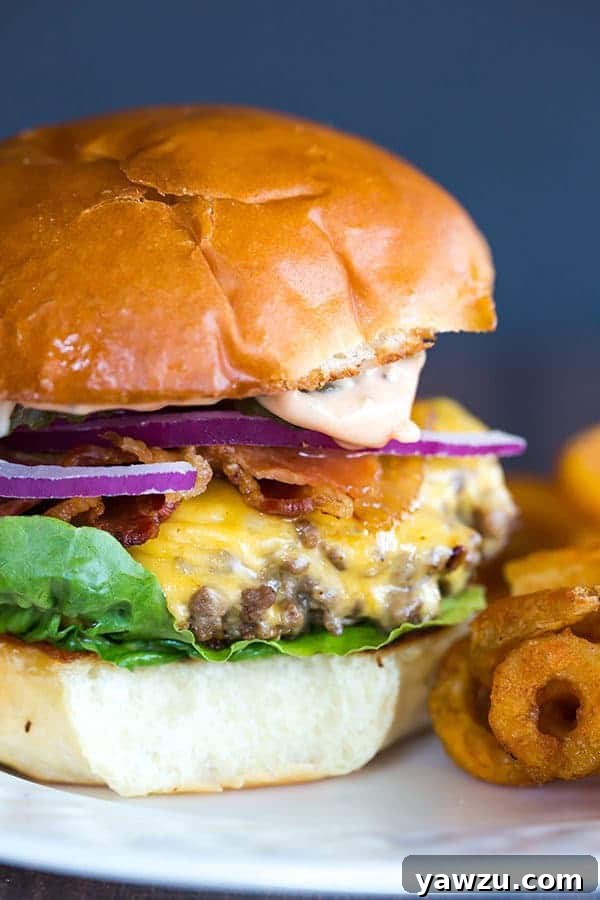 Cast Iron Skillet Cheeseburgers - They're tender, flavorful and never dry! You'll never want to make them on the grill again!