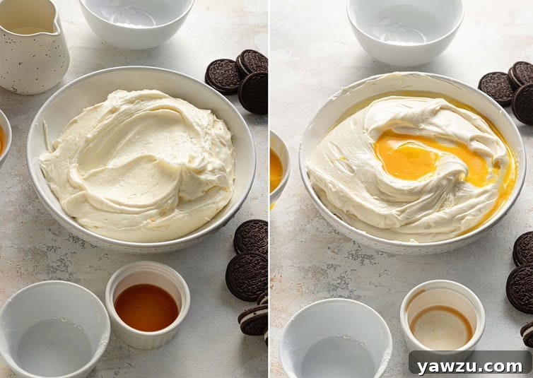 Close-up shot of a stand mixer with the paddle attachment combining the creamy filling ingredients for an Oreo cheesecake in a large bowl.