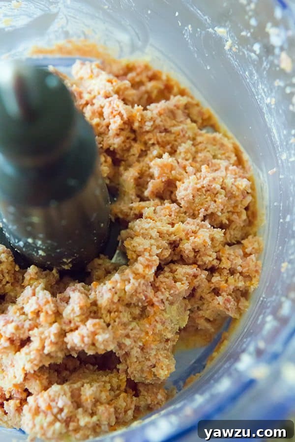 Rigatoni pasta coated in a luxurious Pasta Genovese sauce, garnished with cheese