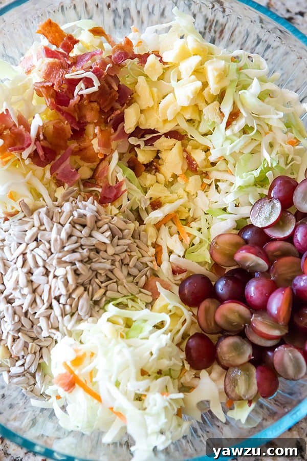 Overhead shot of the colorful coleslaw in a large serving bowl, showcasing the mix of ingredients and creamy dressing.