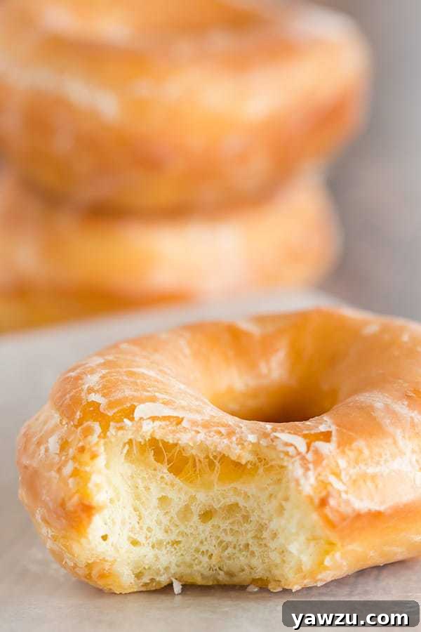 A copycat recipe for Krispy Kreme doughnuts - they're light, airy and covered in a barely-there glaze.