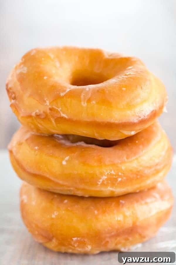 A copycat recipe for Krispy Kreme doughnuts - they're light, airy and covered in a barely-there glaze.