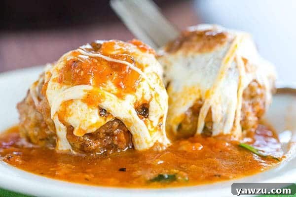 Skillet Meatball Parmesan: An easy skillet meal with awesome meatballs simmered in a tomato sauce and topped with lots of fresh mozzarella.