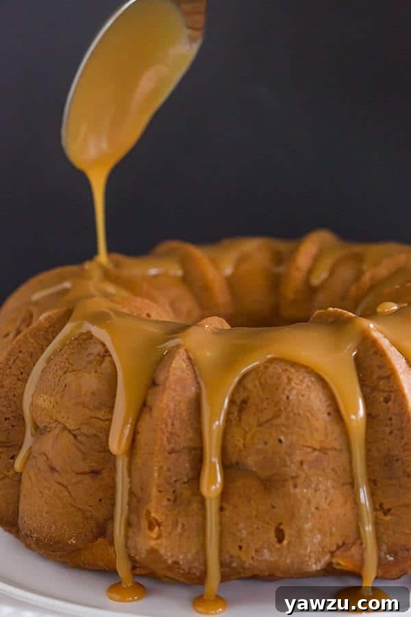 Caramel Apple Bundt Cake - An easy cake recipe baked up in a gorgeous Bundt pan, and topped with a perfect caramel glaze.