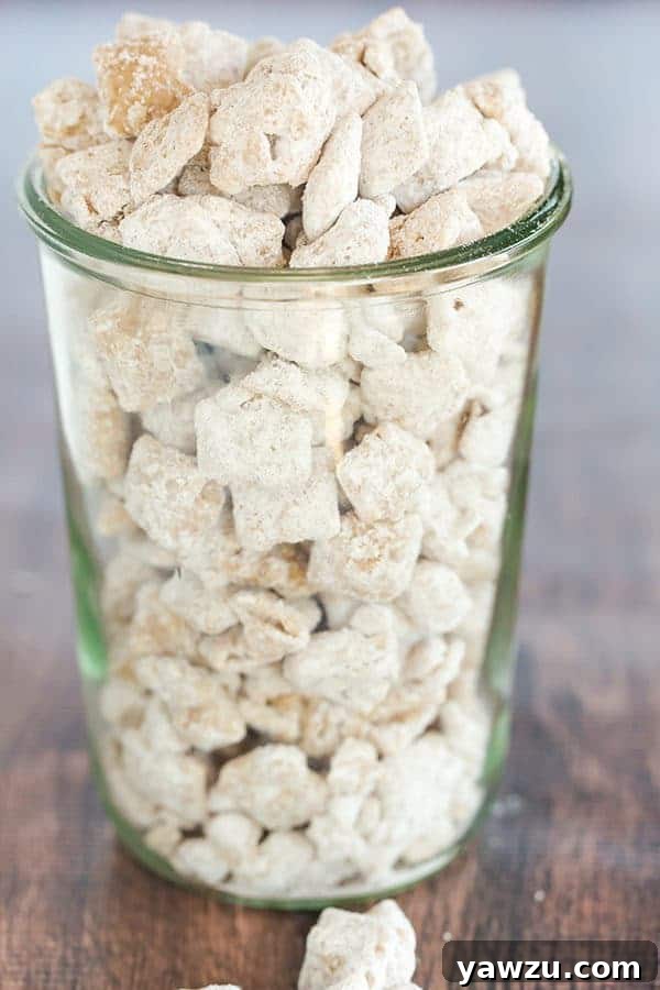 Close-up of Snickerdoodle Muddy Buddies, showcasing the generous cinnamon sugar coating on crispy Rice Chex.