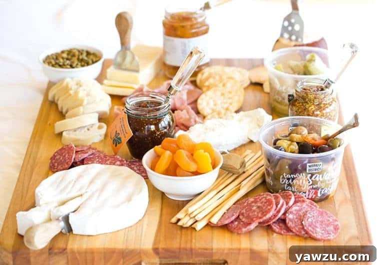 How to present a gourmet cheese platter for entertaining. Includes cheeses, cured meats, and sweet and salty accompaniments for parties. | browneyedbaker.com