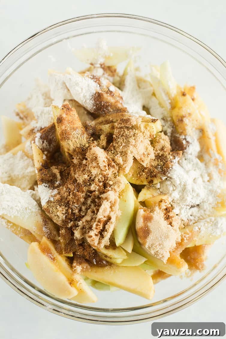 The filling for apple crisp prepped in a bowl.