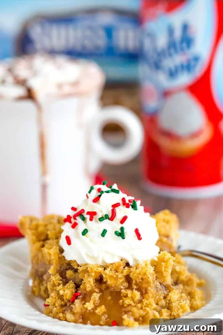 A beautifully composed image of Peppermint Bark Hot Chocolate alongside a slice of Marie Callender's Dutch Apple Pie, embodying the essence of a comforting holiday dessert spread.