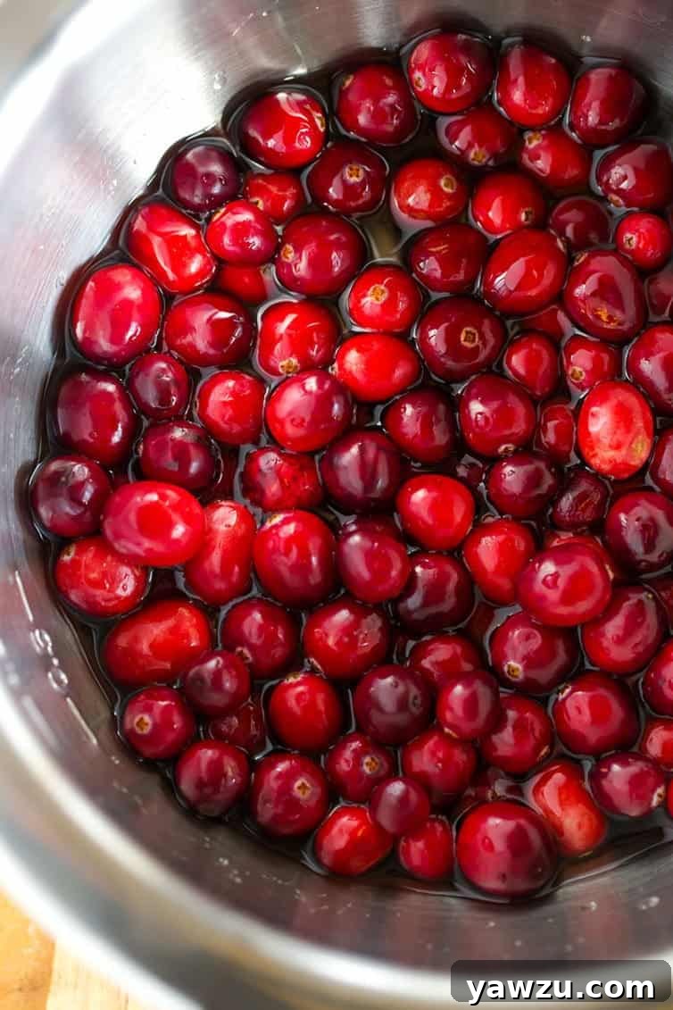 Close-up of sparkling sugared cranberries on a white plate