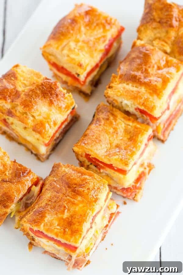 This easy antipasto appetizer bake features layers of Italian meats and cheese, sandwiched between layers of crescent dough. Great for parties!