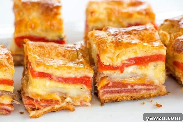 This easy antipasto appetizer bake features layers of Italian meats and cheese, sandwiched between layers of crescent dough. Great for parties!