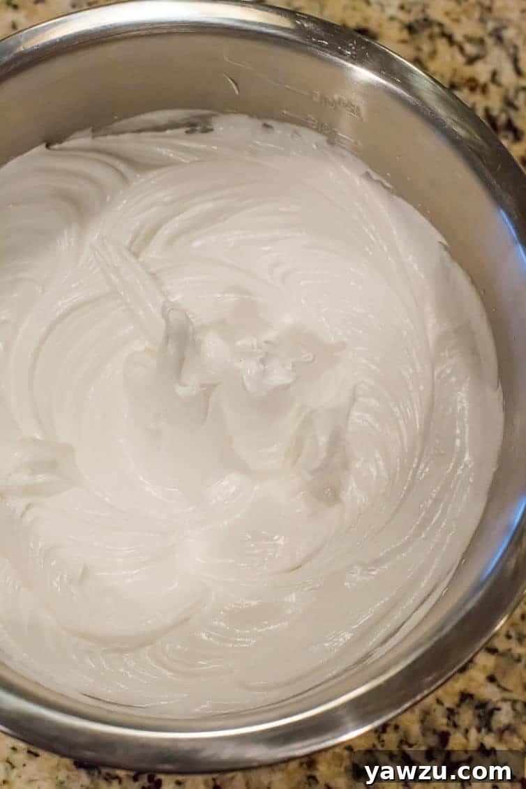 Glossy stiff meringue ready to be piped and baked into pavlova layers.