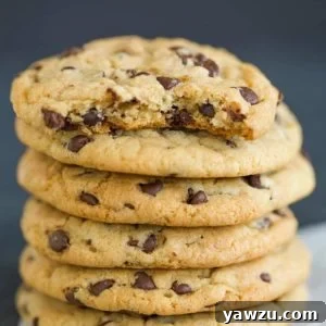 A big stack of soft and chewy chocolate chip cookies.