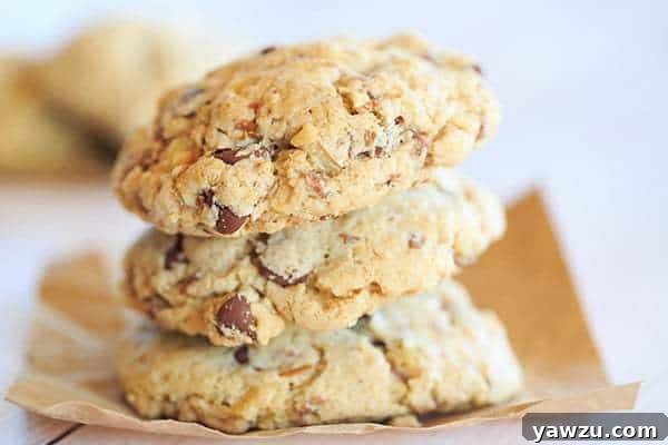 A warm, gooey Neiman Marcus cookie just out of the oven, showcasing its rich texture and generous chocolate and walnut inclusions.