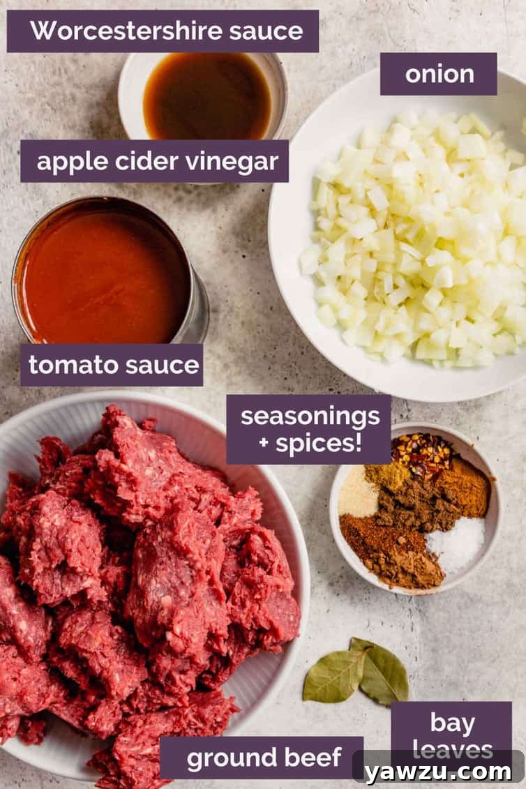 Ingredients for Cincinnati chili prepped and labeled, showcasing the unique spices like cinnamon, cumin, and cocoa powder.
