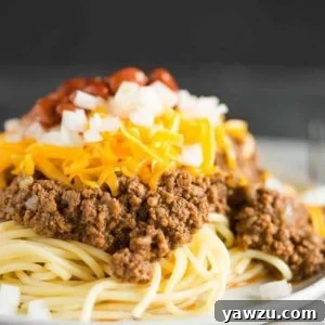 A plate of Cincinnati chili five way, showcasing all the delicious toppings.