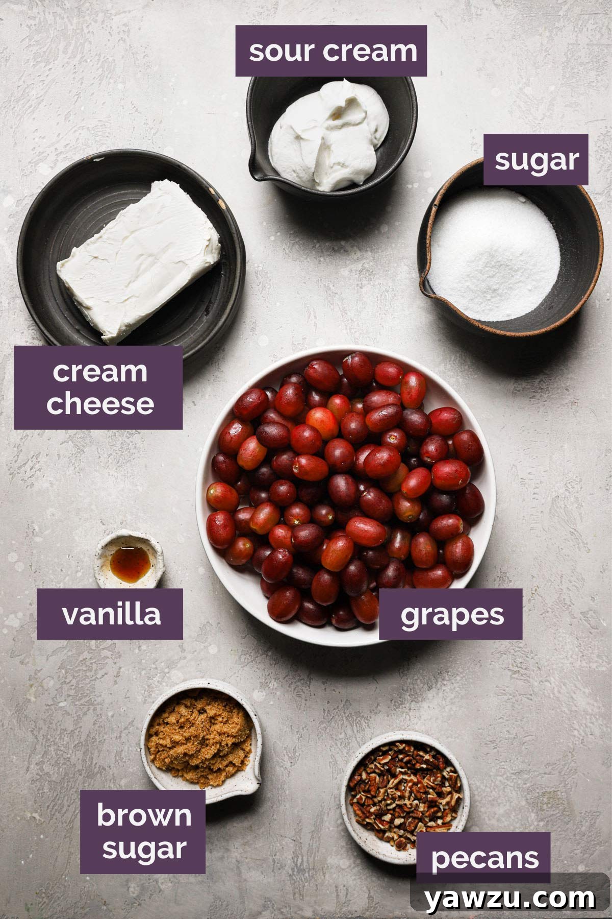 An overhead view, clearly labeling all the fresh ingredients needed to prepare this easy and delicious grape salad recipe.